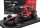 Burago - ALFA ROMEO F1  C43 TEAM STAKE N 24 SEASON 2023 GUANYU ZHOU - CON PILOTA E VETRINA - WITH PILOT AND SHOWCASE - EXCLUSIVE CARMODEL BLACK RED